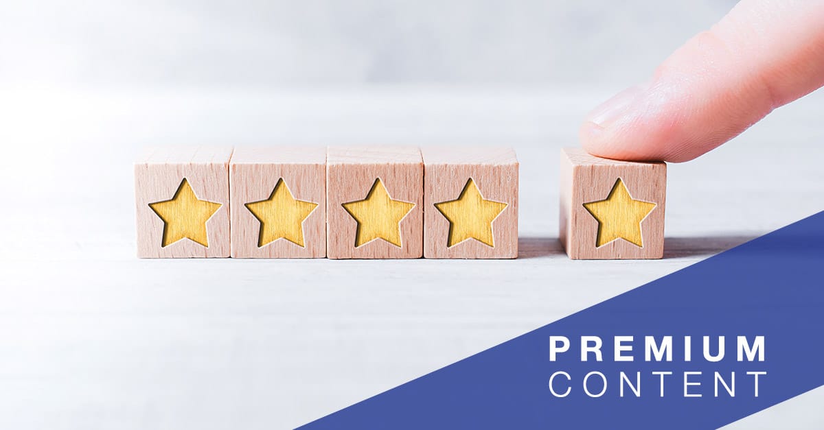 5 Star Ranking Formed By Wooden Blocks And Arranged By A Male Finger On A White Table