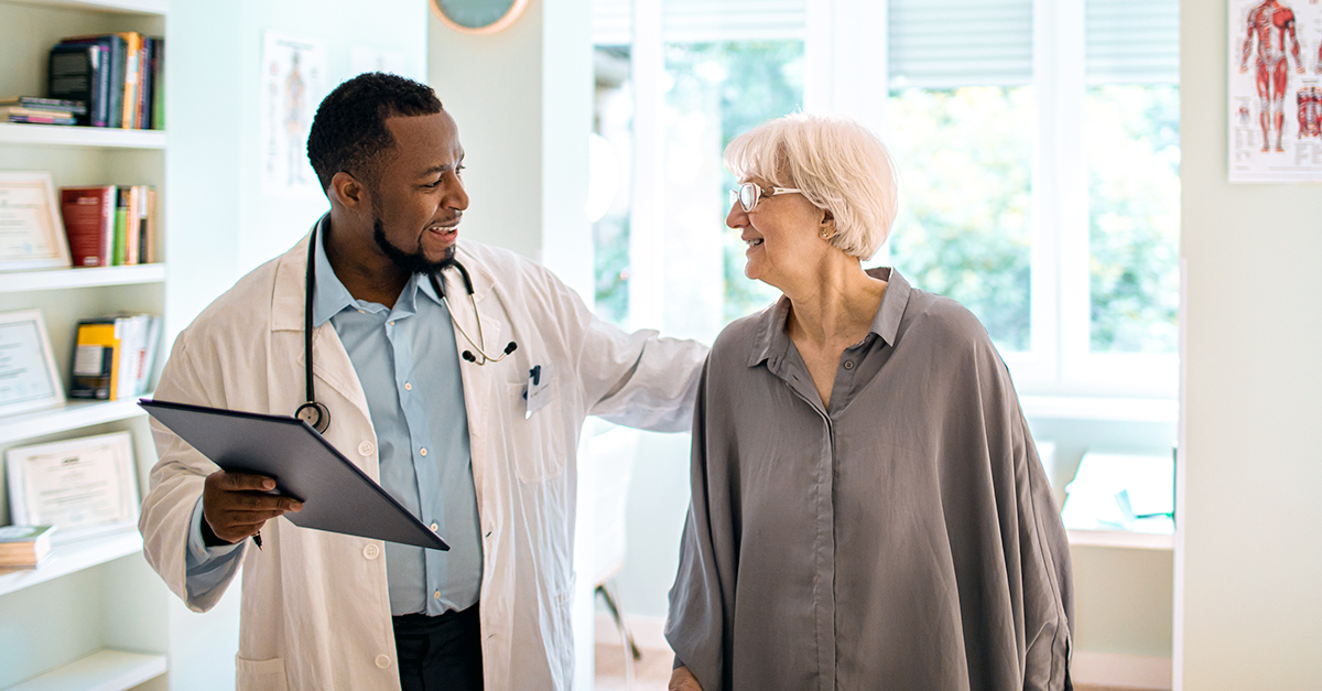 Doctor happily speaking with patient
